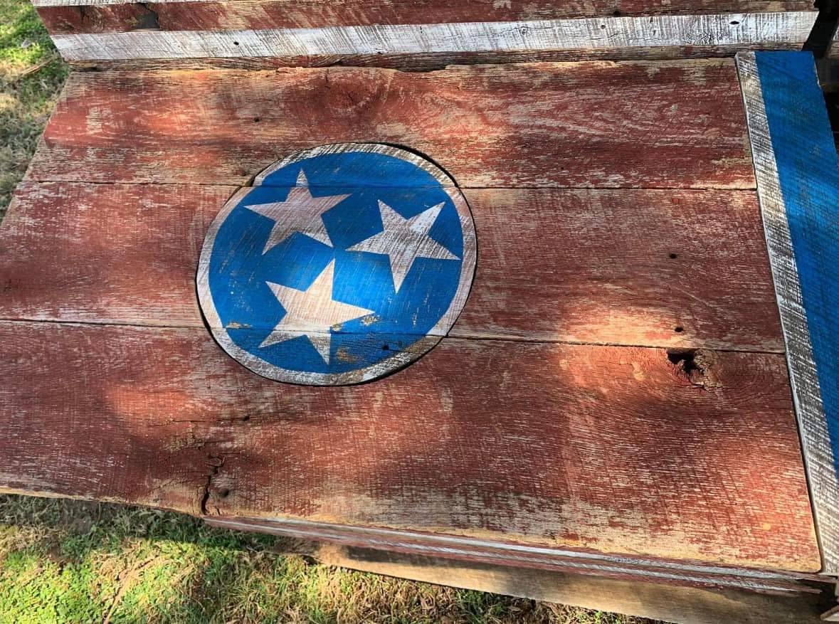 Craftsman with a handcrafted barnwood American flag